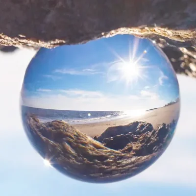 A glass ball projecting a reverse landscape image